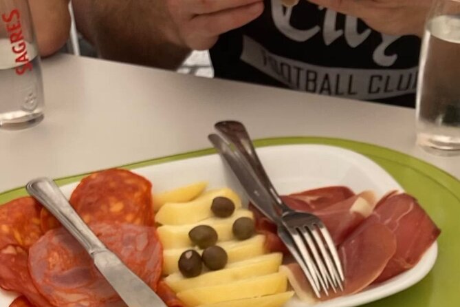 Lisbon E-Bike Guided Food Tour with Five Food Tastings - Visiting Praca Da Figueira, Lisbon’s Historic Marketplace