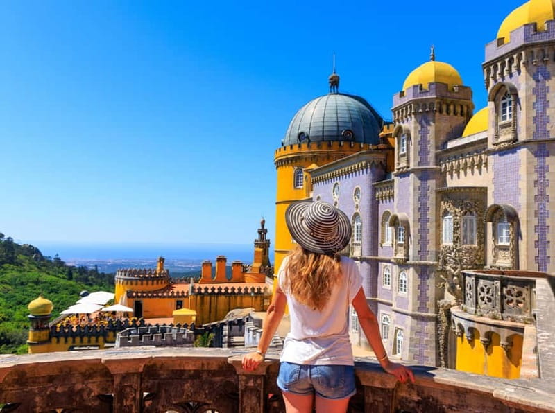 Lisbon: Pena Palace, Sintra, Cabo da Roca & Cascais Day Trip - Scenic Return Journey Through Estoril and Coastal Views