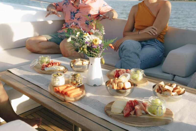 Lisbon Sunset Boat Tour with local Snacks & Drinks - A Taste of Local Flavors with Snacks and Green Wine