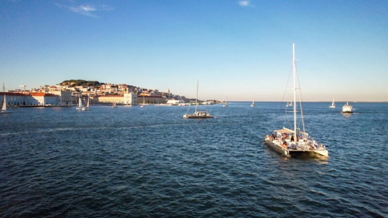 Lisbon: Sunset Catamaran Tour with Music and Drink - Included Drink and the Onboard Ambience