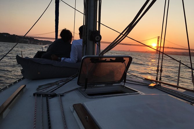 Lisbon Sunset Sailing Tour with White or Rosé Wine and Snacks - Enjoying Wine and Snacks on the Water