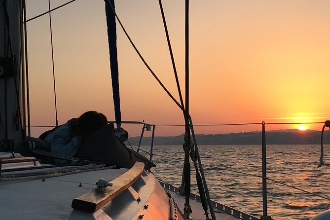 Lisbon Sunset Sailing Tour with White or Rosé Wine and Snacks - The Experience of Watching Sunset on the River