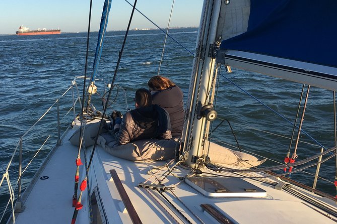 Lisbon Sunset Sensations on a Private Sailing Boat with wine&snacks - The Experience on Board: Food, Drink, and Ambience