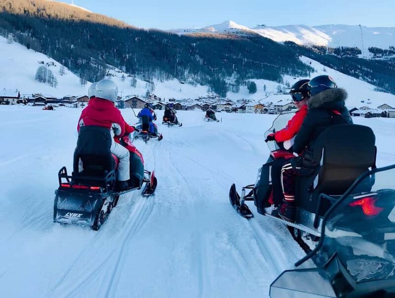 Livigno: Snowmobile Ride on Lake Livigno in the Alps - Lake Livignos Frozen Surface and Scenic Surroundings
