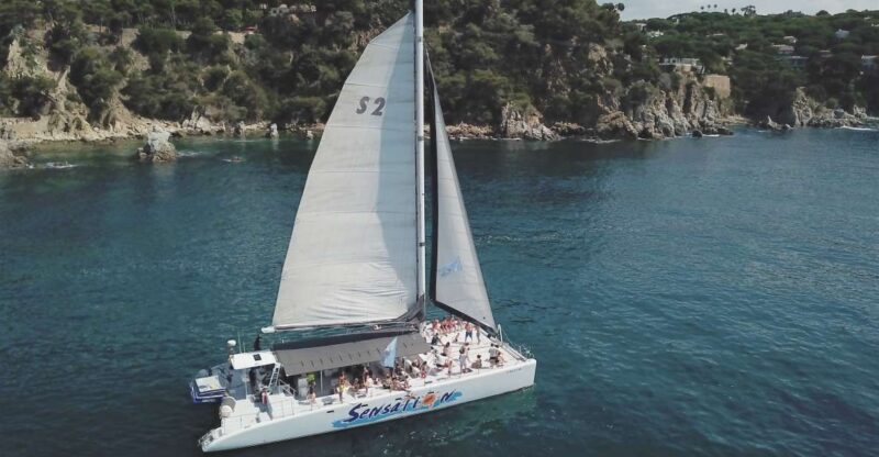 Lloret de Mar: Sunset Catamaran Cruise with DJ and Drinks - The Scenic Route on the Costa Brava Shoreline