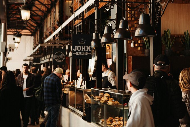 Local Tapas, Beer and Wine Tour of Madrid All Inclusive - Tasting the Squid Sandwich at Plaza Mayor