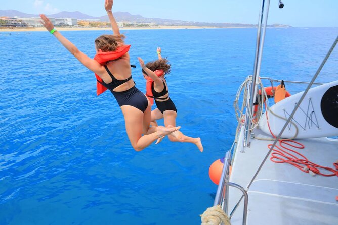 Los Cabos Party Catamaran: Snorkeling, Open Bar & Music Fun - Food, Drinks, and Onboard Entertainment