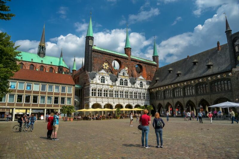 Lübeck: Old Town Highlights Private Walking Tour - Passing Riverside Salt Warehouses and Historic Bridges
