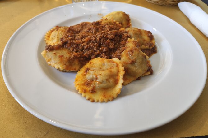 Lucca: Taste Tuscany on a Full Meal Food Tour by Do Eat Better - Tasting Tordelli at Basilica di San Frediano