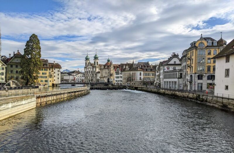 Lucerne - Old Town private walking Tour - Crossing the Chapel Bridge and Visiting St. Peters Chapel