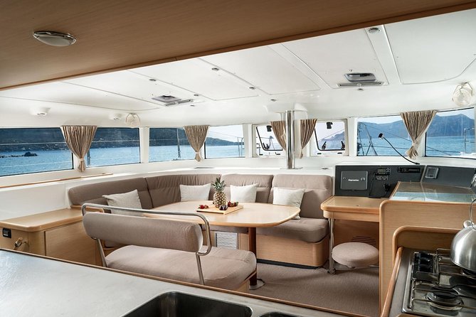 Luxury Caldera Cruise with a rich BBQ meal and drinks! - Enjoying a Rich BBQ Meal and Drinks on Board