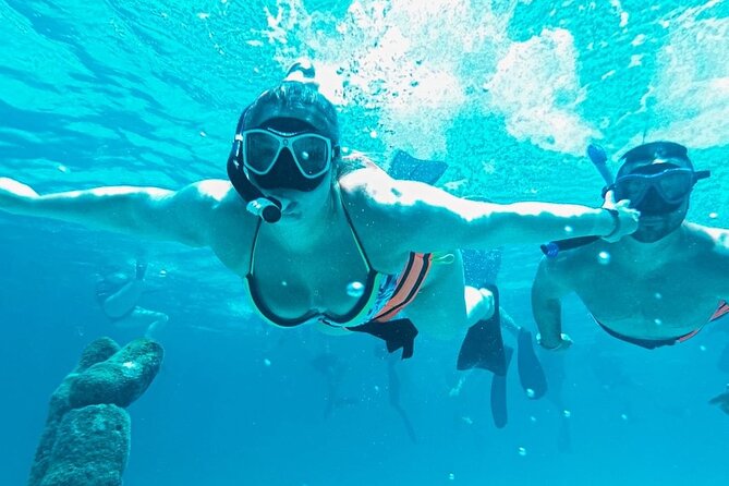 Luxury Catamaran to Isla Mujeres, Snorkeling, Buffet and Ice Bar - Sunset Return with Music, Drinks, and a Celebration Atmosphere