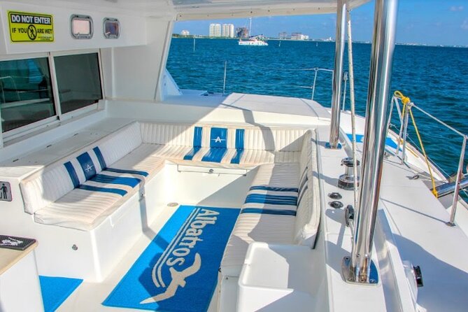 Luxury Catamaran Tour to Isla Mujeres with Transportation - Indulging at Club Playa Mexico