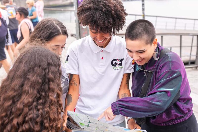 Madrid: Explore the City in an Electric Tuk Tuk - Admiring the Towering Statue of Miguel de Cervantes at Plaza de España