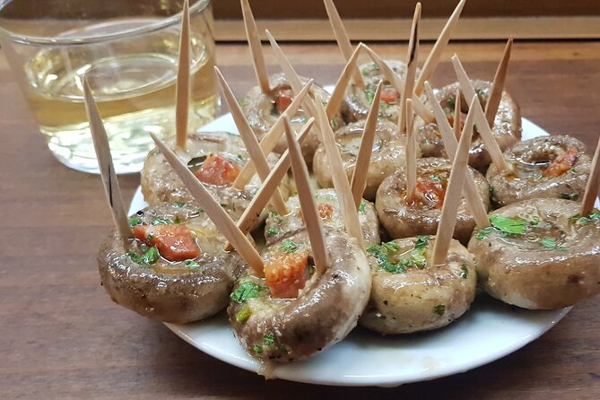 Madrid History Food Tour: Tapas & Drinks Tasting - Tasting Madrid’s Signature Garlic Shrimp with Spanish Wine