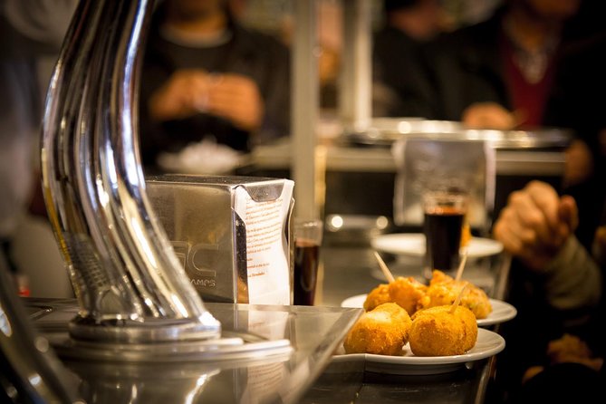 Madrid Local's Tapas Tour Dinner with a side of History - From Calle Preciados to the Royal Palace: The Tour Starts with Classic Madrid Flavors