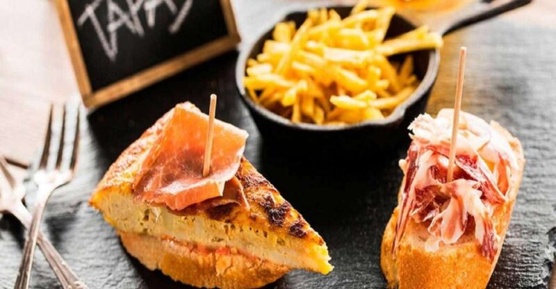 Madrid: Old Madrid Walking Food and Wine Tour - Starting Point at Puerta del Sol with a Red Umbrella