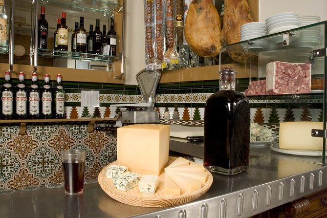 Madrid Old Town Tapas and Wine Small Group Tour - Tasting Iberico Presa in an Elegant Historic Setting