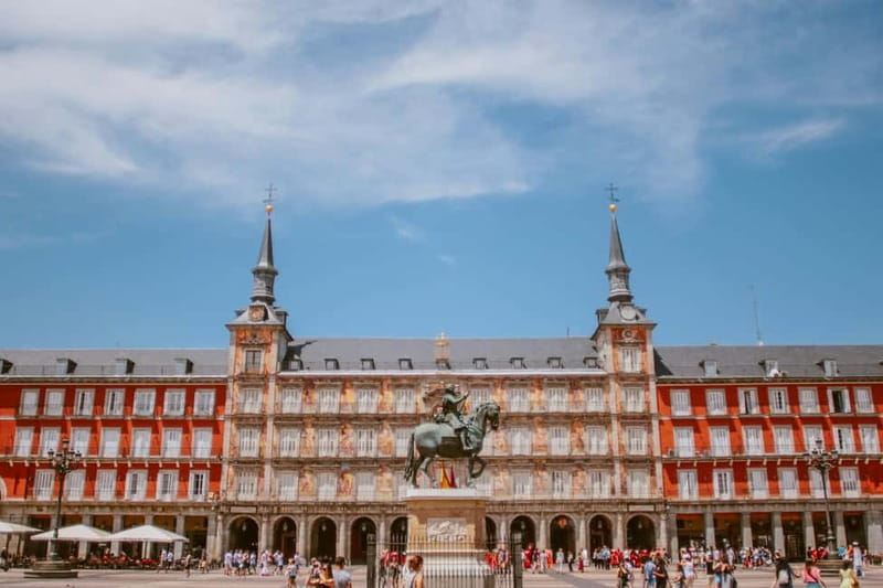 Madrid: Small Group Tour with Tapas & Drinks - Visiting Madrid’s Iconic Landmarks: Almudena Cathedral and Royal Palace