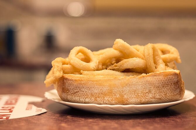 Madrid Walking Food Tour With Secret Food Tours - Trying the Local Favorite: Deep Fried Squid Sandwich