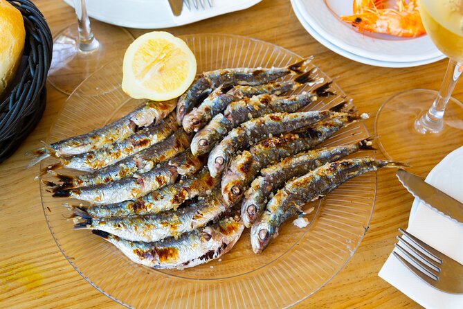 Malaga Food Tour: Tapas, Drinks and Delights with a Local - Tasting Malagueño Delights at a Bustling Local Spot