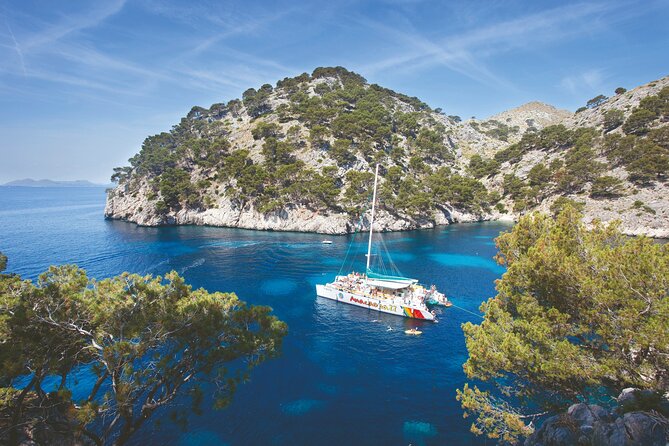 Mallorca Catamaran Cruise with Scenic Views and BBQ Lunch - The Experience with Kayaks, Paddleboards, and Snorkeling Equipment