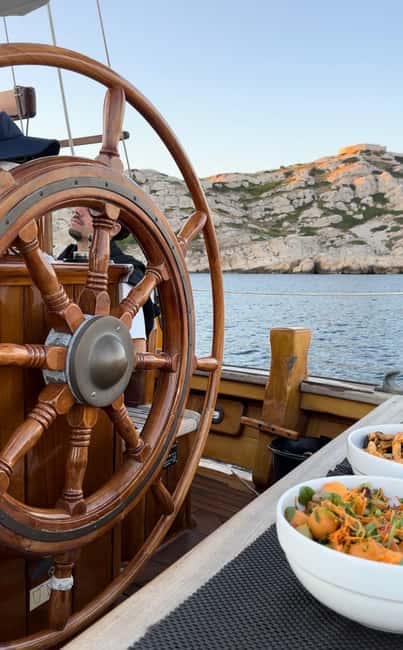 Marseille: Evening sailboat trip to the Calanques du Frioul with buffet and organic wine - Sunset and Evening Views of Marseille by Night