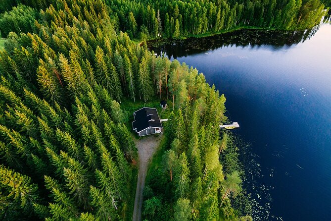 Midnight Sun Floating Experience in Forest Lake - The Use of Floating Survival Suits and Safety Measures