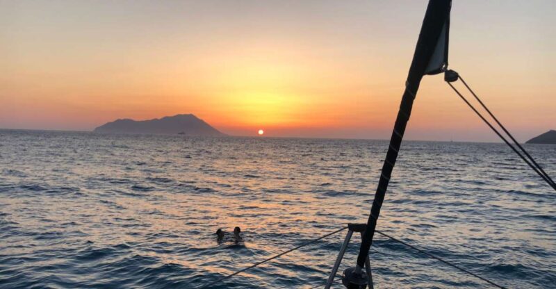 Milos: Sunset Catamaran Cruise with Kleftiko Visit - Stops at Kalogries Bay for Swimming and Relaxation