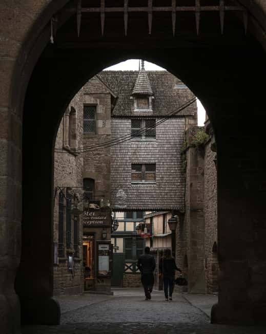 Mont Saint-Michel: Guided tour of the village and optional abbey entrance - The Atmosphere and Local Flavors
