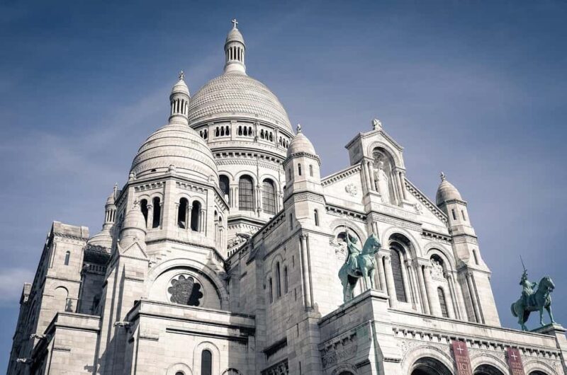 Montmartre and Sacré-Coeur tour with a Parisian - Strolling Through Montmartre’s Festive Streets