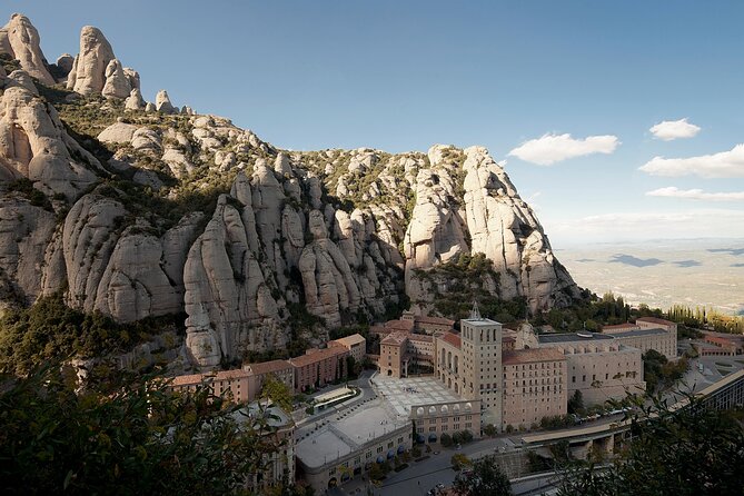 Montserrat Complete Guided Tour & The Boys Choir's Performance - Walking Through Montserrat Museum and Religious Sites