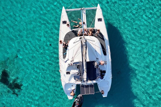 Morning and Sunset Cruise with Meal and Transport Included - Explore the Stunning Mykonos Catamaran Cruise for a Memorable Day or Sunset Outing