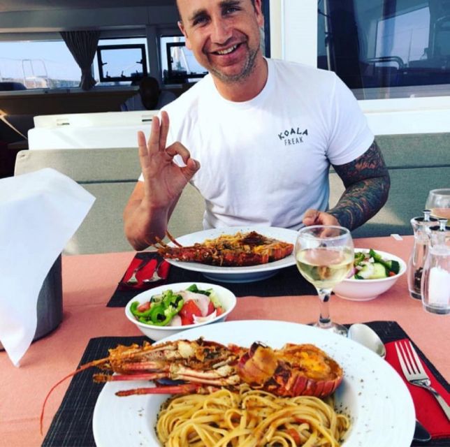 Mykonos: Full-Day Catamaran Cruise with Fresh Lunch - Visiting Remote Delos and Rhenia Beaches