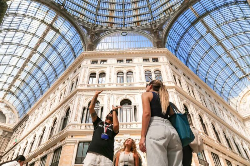 Naples: Guided Walking Tour with Food and Drinks - Walking Down Spaccanapoli: The Narrow Street That Splits the City