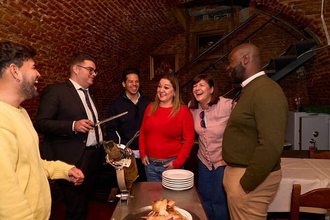 New! Madrid: Not Just Another Tapas & Wine Tour by Eating Europe - Slicing Jamón Ibérico in an Underground Rioja Cellar