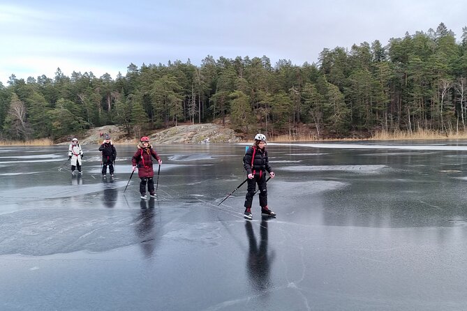 Nordic Ice Skating on a Frozen Lake in Stockholm - Scenic Views of Snowy Woods and Rock Formations