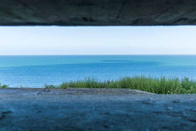 Normandy D-Day Small-Group Day Trip with Omaha Beach, Cemetery & Cider Tasting - Inside a German Bunker at Batterie de Longues-Sure-Mer
