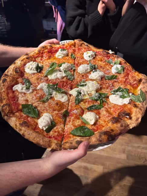 NYC: Viral Food Tours, West Village - Starting Point in the Heart of the Park with Bright T-Shirt Signage