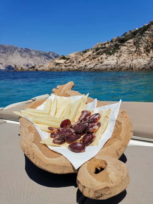 Olbia: Dinghy tour to the islands of Tavolara and Molara, swimming and snorkeling - Molara Island: Natural Pools and Regional Flavors