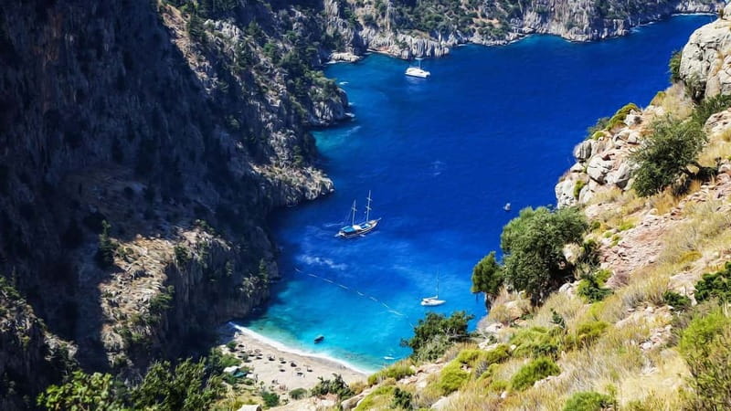 Ölüdeniz: Blue Cave, Butterfly Valley & Lunch Boat Tour - Visiting the Blue Cave and Its Vibrant Waters