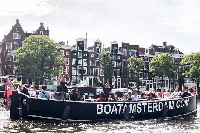 Open Boat Canal Cruise in Old City Centre of Amsterdam - A Close-Up View of the Amstel River and Iconic Bridges
