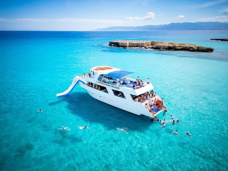 Paphos/Akamas: Blue Lagoon Bus & Boat Tour with Water Slide - Visiting the Baths of Aphrodite and Sea Caves