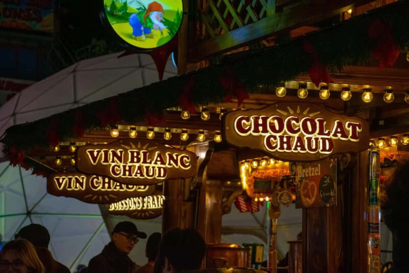 Paris Christmas Lights Walking Tour with Local Guide - Inside La Madeleine Church’s Festive Atmosphere