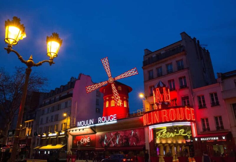 Paris: First Show Moulin Rouge with Champagne & Seine Cruise - The Night Begins at Moulin Rouge on Boulevard de Clichy