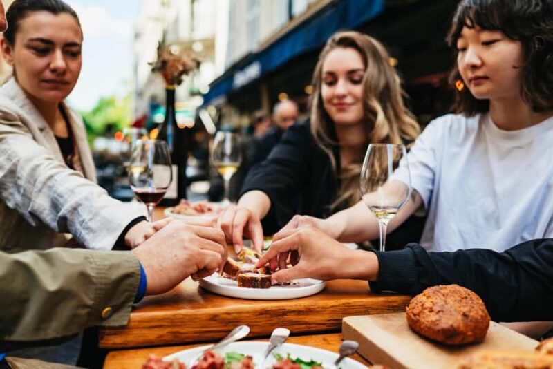 Paris: Gastronomy & Wine Tour by a Culinary School - Visiting a Historic Charcuterie and Cheese Shop