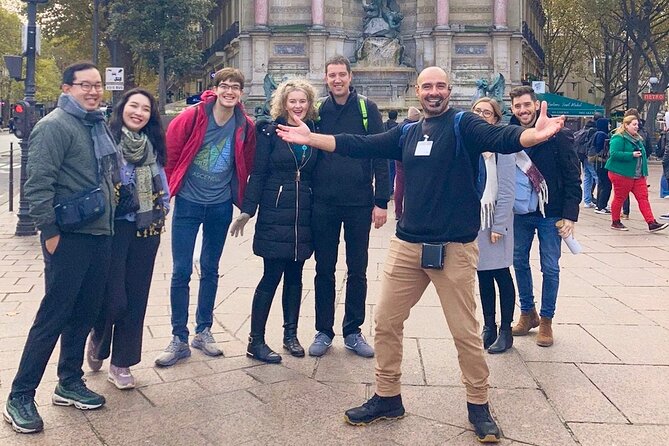 Paris - Historic City Center Walking Tour - Relaxing in Place Dauphine and Visiting Henri IVs Statue