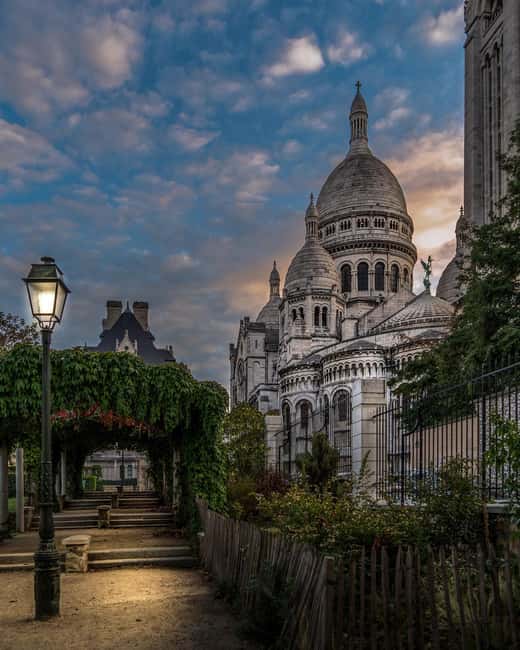 Paris: Montmartre hidden gems walking Tour with Local Guide - The Moulin de la Galette and Montmartre Landmarks
