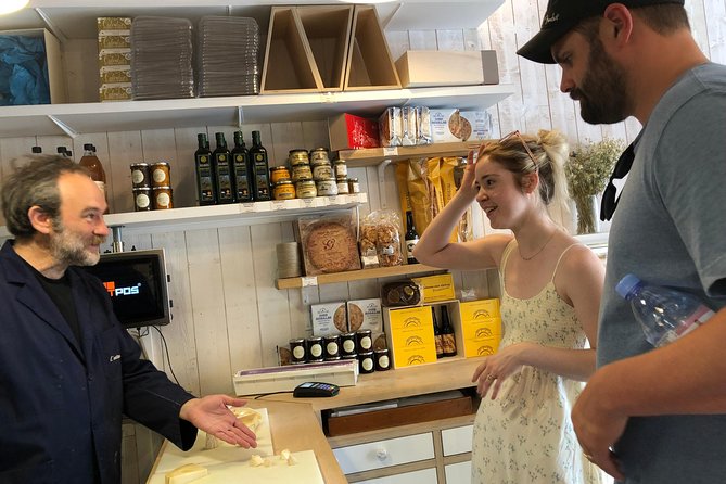 Paris South Montmartre Gourmet French Flavors Tasting Food Tour - Tasting Cheese and Wine at Historic Fromageries