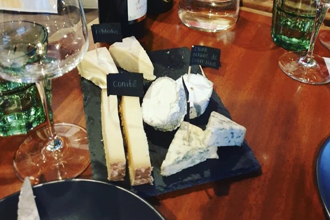 Paris Top Sights Half Day Walking Tour + Wine Tasting Experience - Notable Sightseeing Stops for Photos and Brief Looks